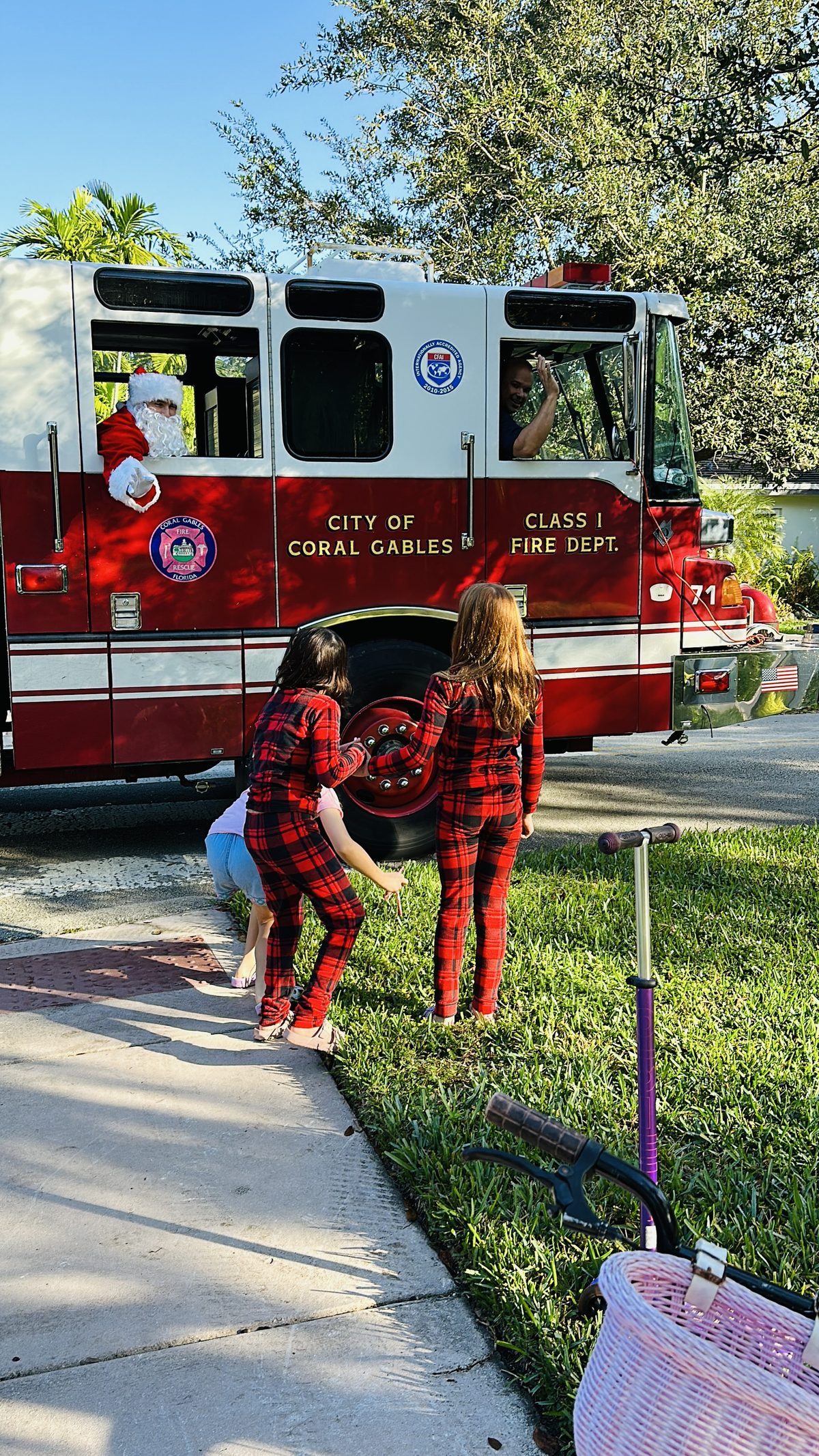 Coral Gables Fire Department truck visiting residential neighborhoods with Santa each December