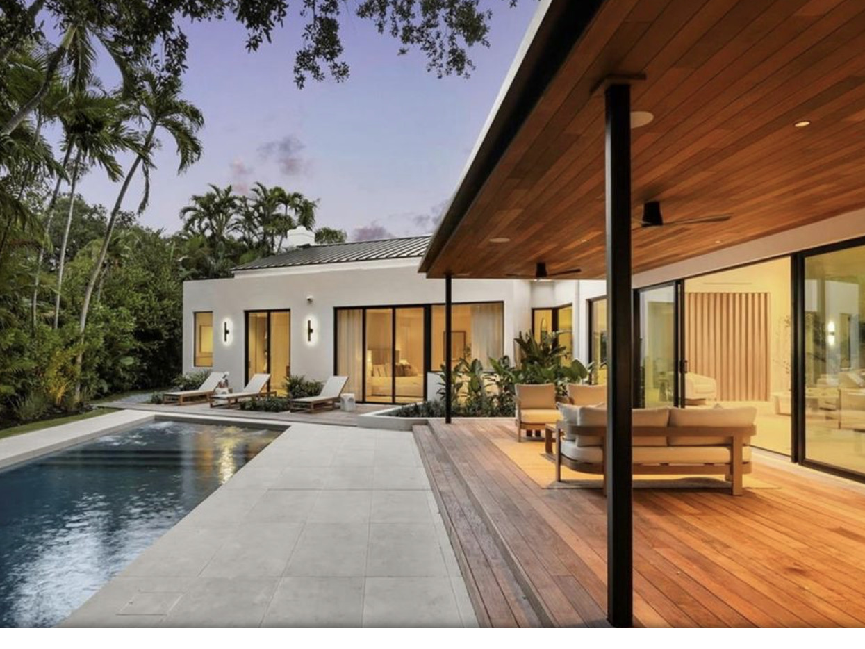 1701 Micanopy Avenue — pool and covered terrace at dusk